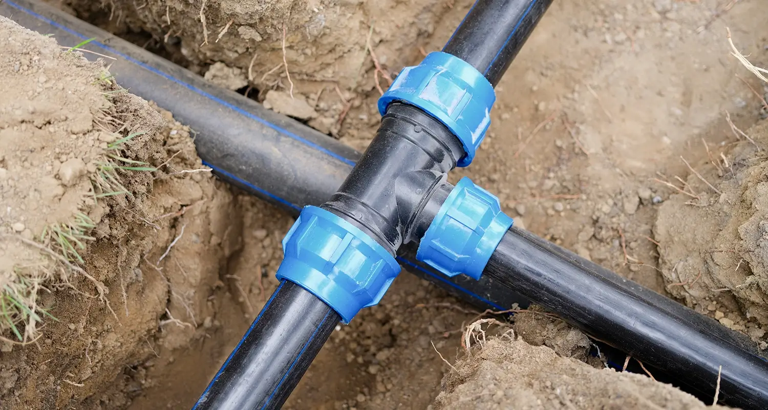 Underground plumbing pipes in a trench.