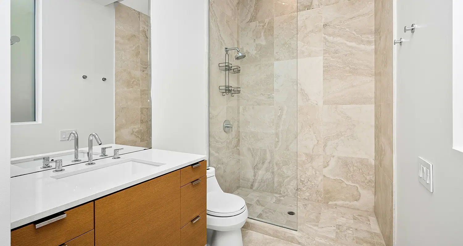 Bathroom with a walk in shower.